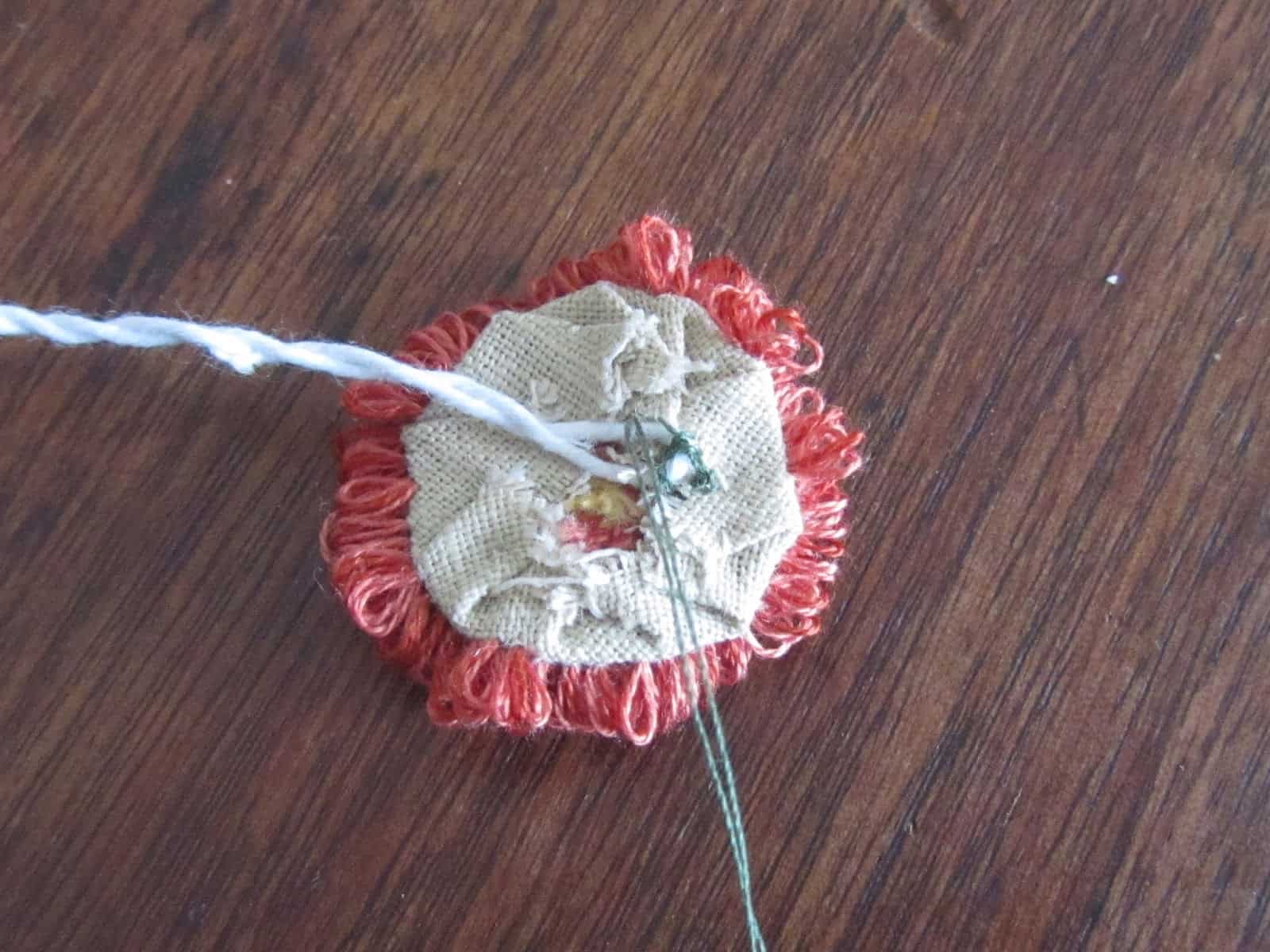 sewing the wire to the flower