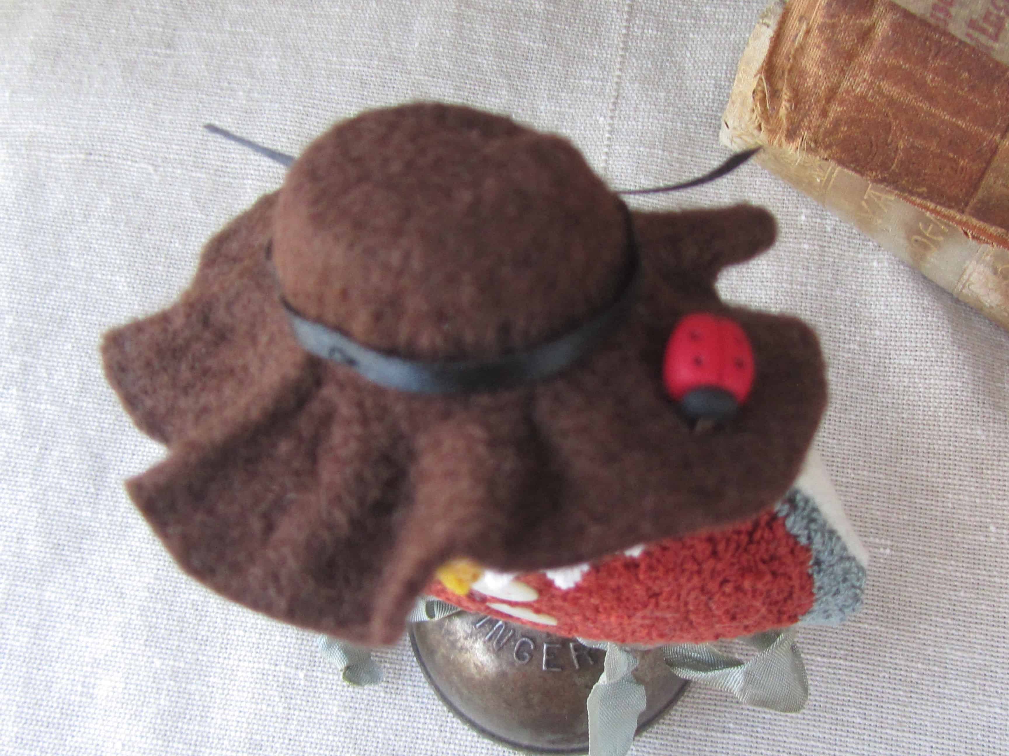 Felt hat with ladybug