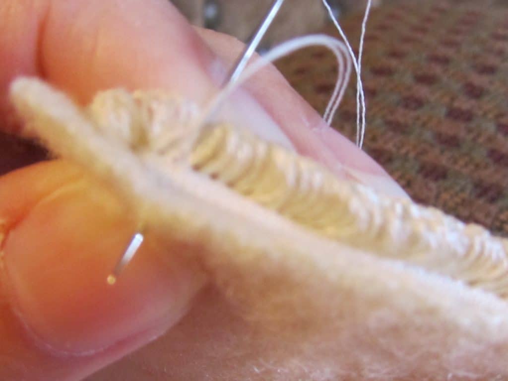 Whipstitch the weavers cloth and wool