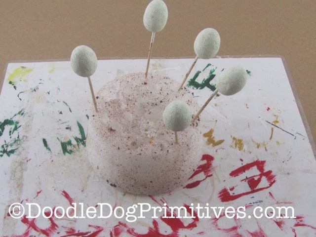 Painting a base coat on the styrofoam eggs