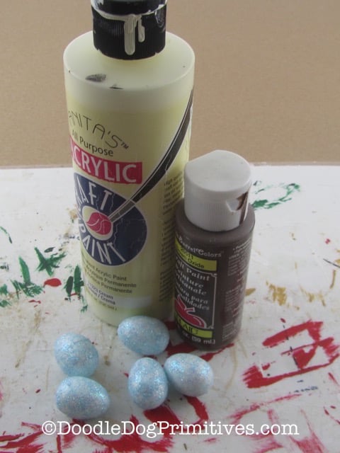 Paints and eggs needed for this craft