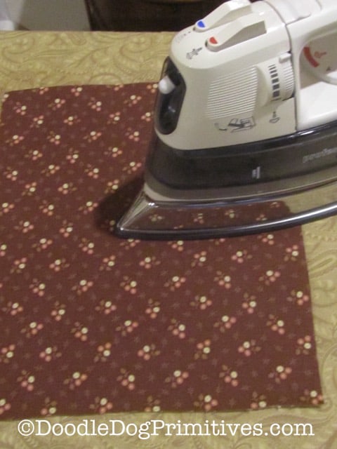 Ironing the front of the cotton quilting fabric