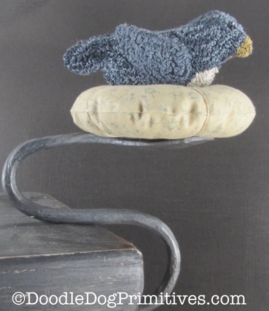 Blue bird nesting pin cushion on clamp