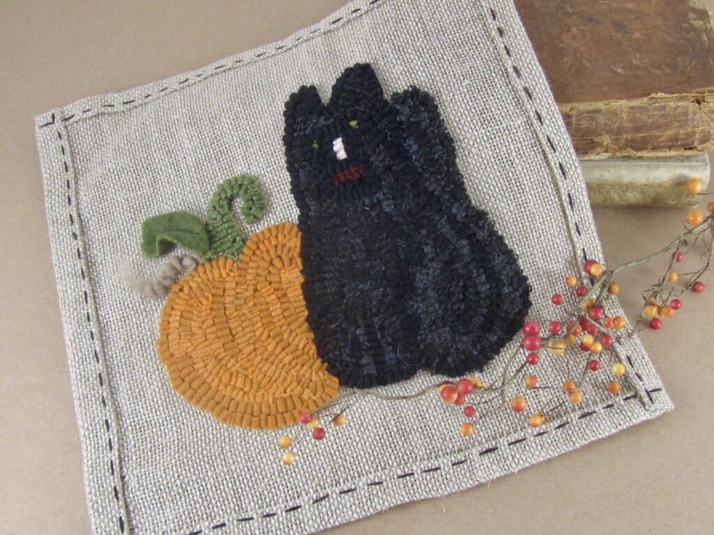black cat and pumpkin  hooked rug