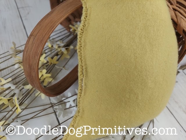 back of chick hooked rug pillow