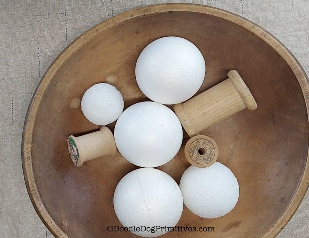 styrofoam and spools in treenware bowl