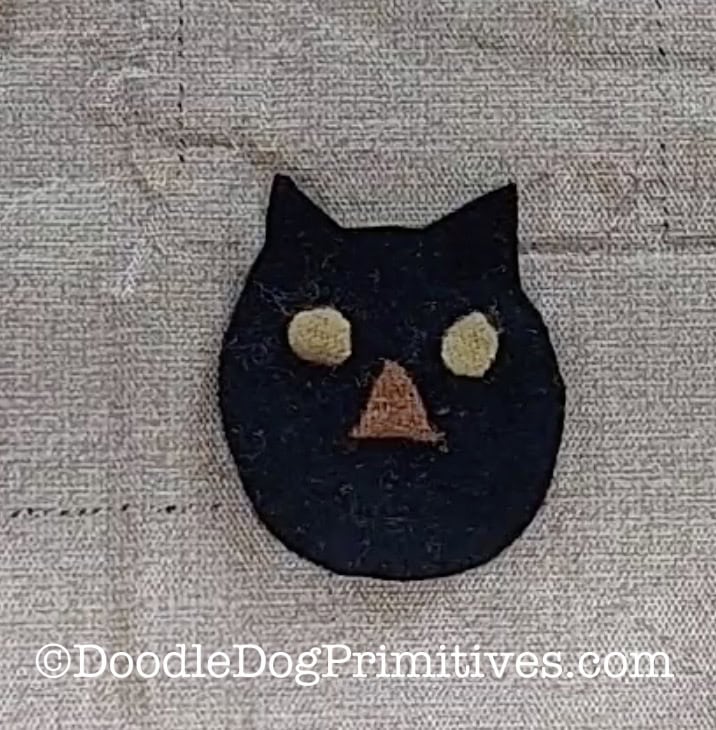 black cat with eyes and nose