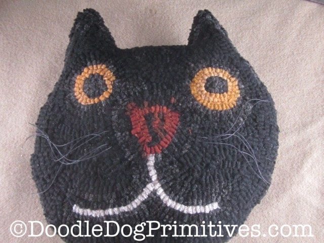 black cat hooked pillow