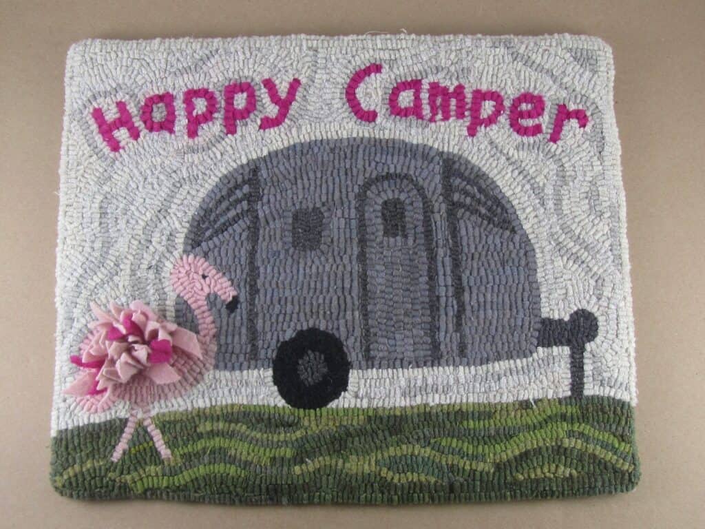 silver camper and flamingo hooked rug