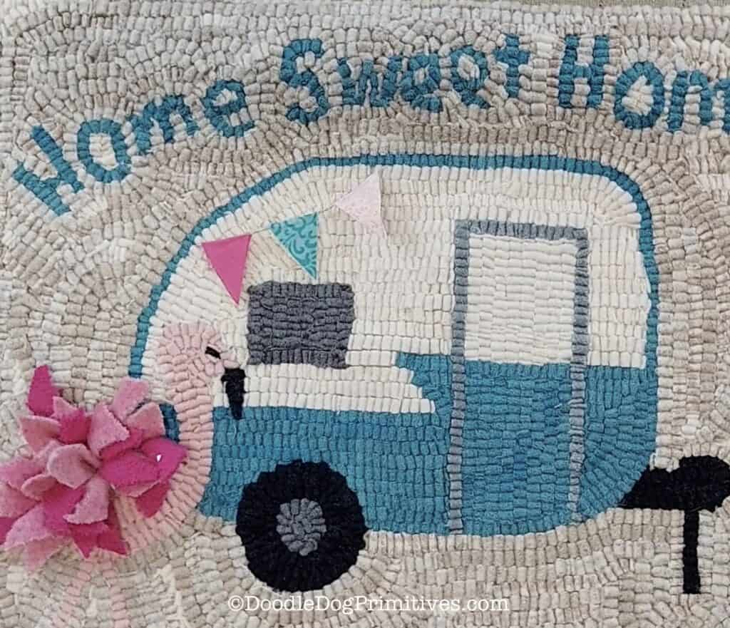 camper hooked rug with banner