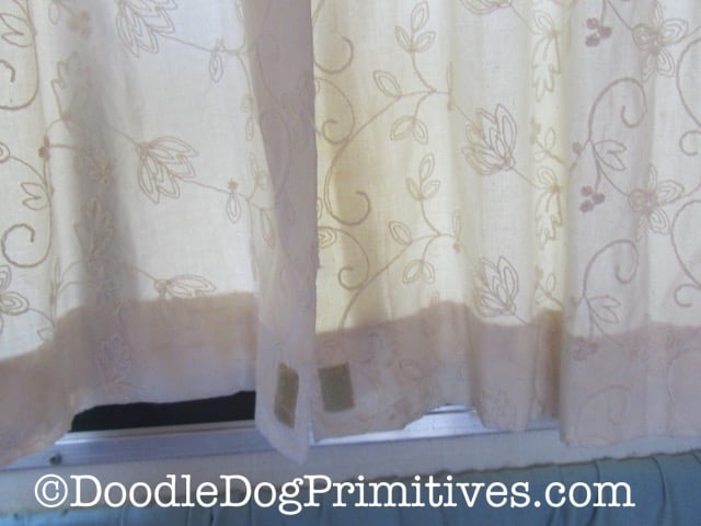 Hung vintage camper curtains