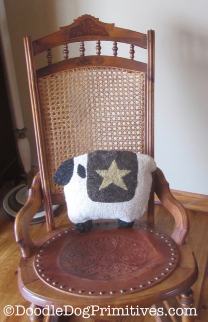 sheep pillow in rocking chair