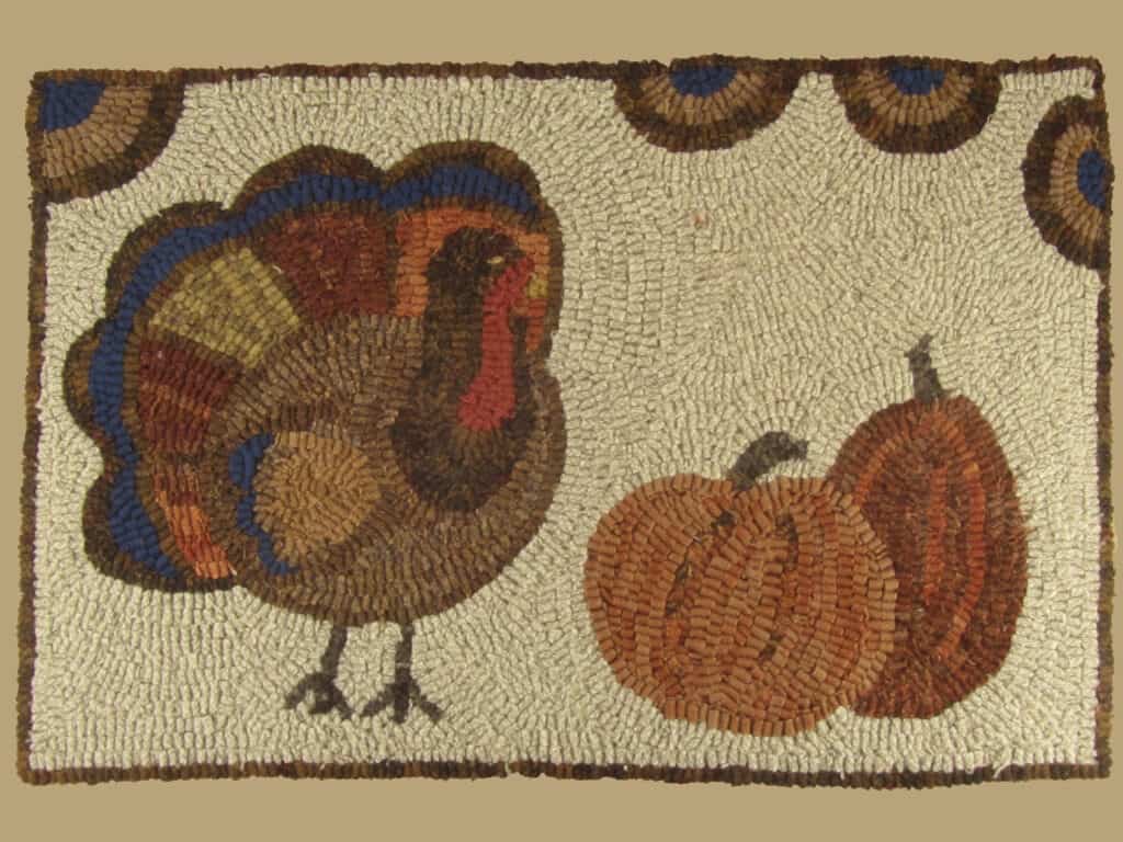 Primitive pumpkin hooked rug