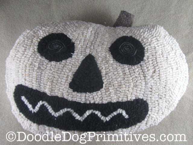 white pumpkin hooked rug pillow